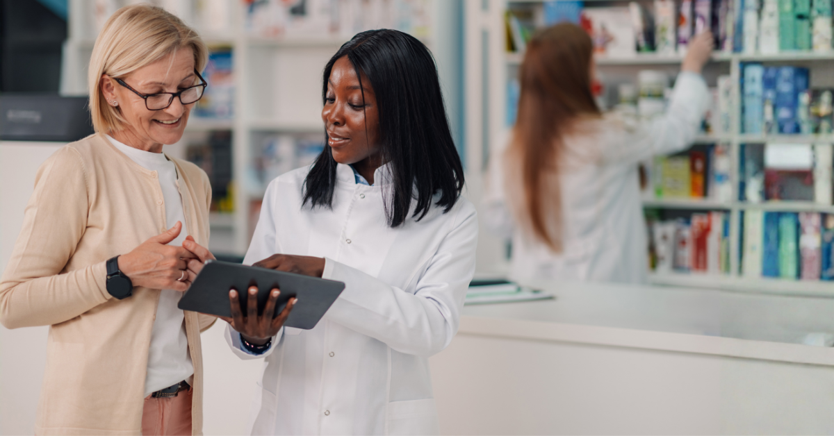 A pharmacist providing a clinical service to a patient in the pharmacy